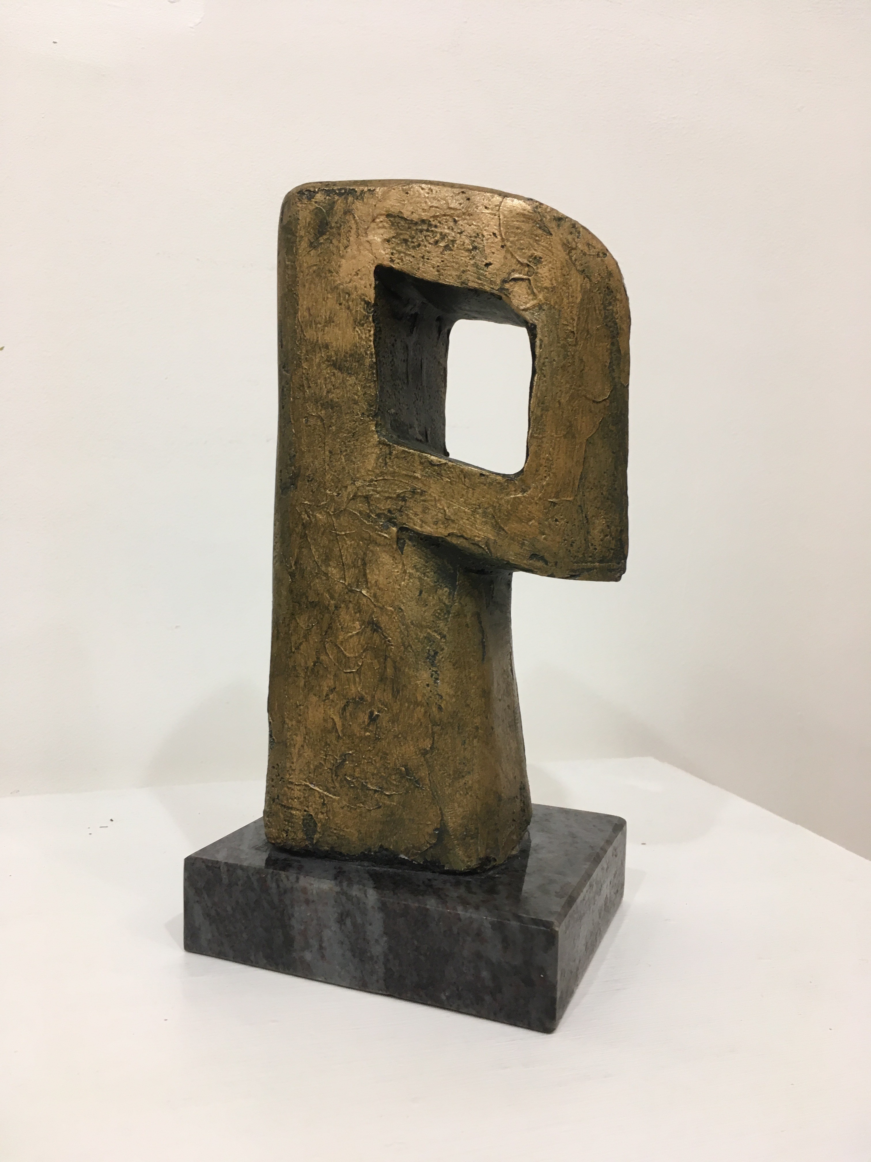 'Sentinel - Bronze Carving with Granite Base' by artist Tom Allan